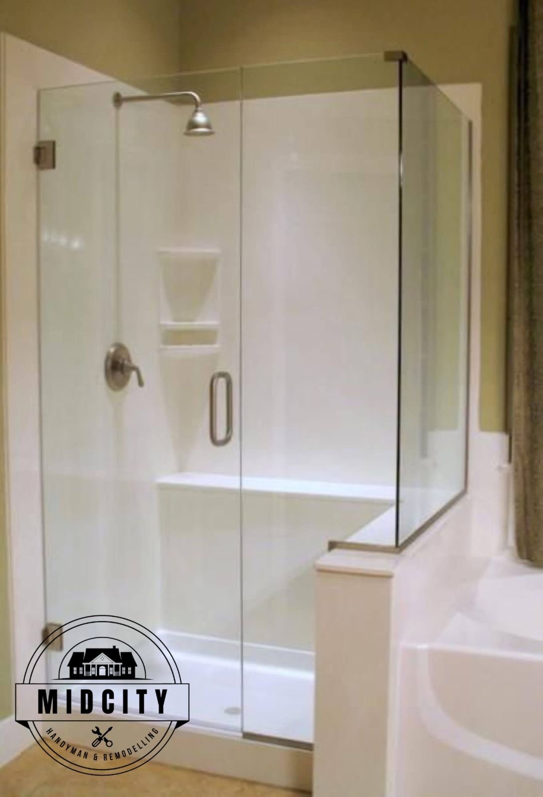 Frameless glass shower enclosure with white subway tile